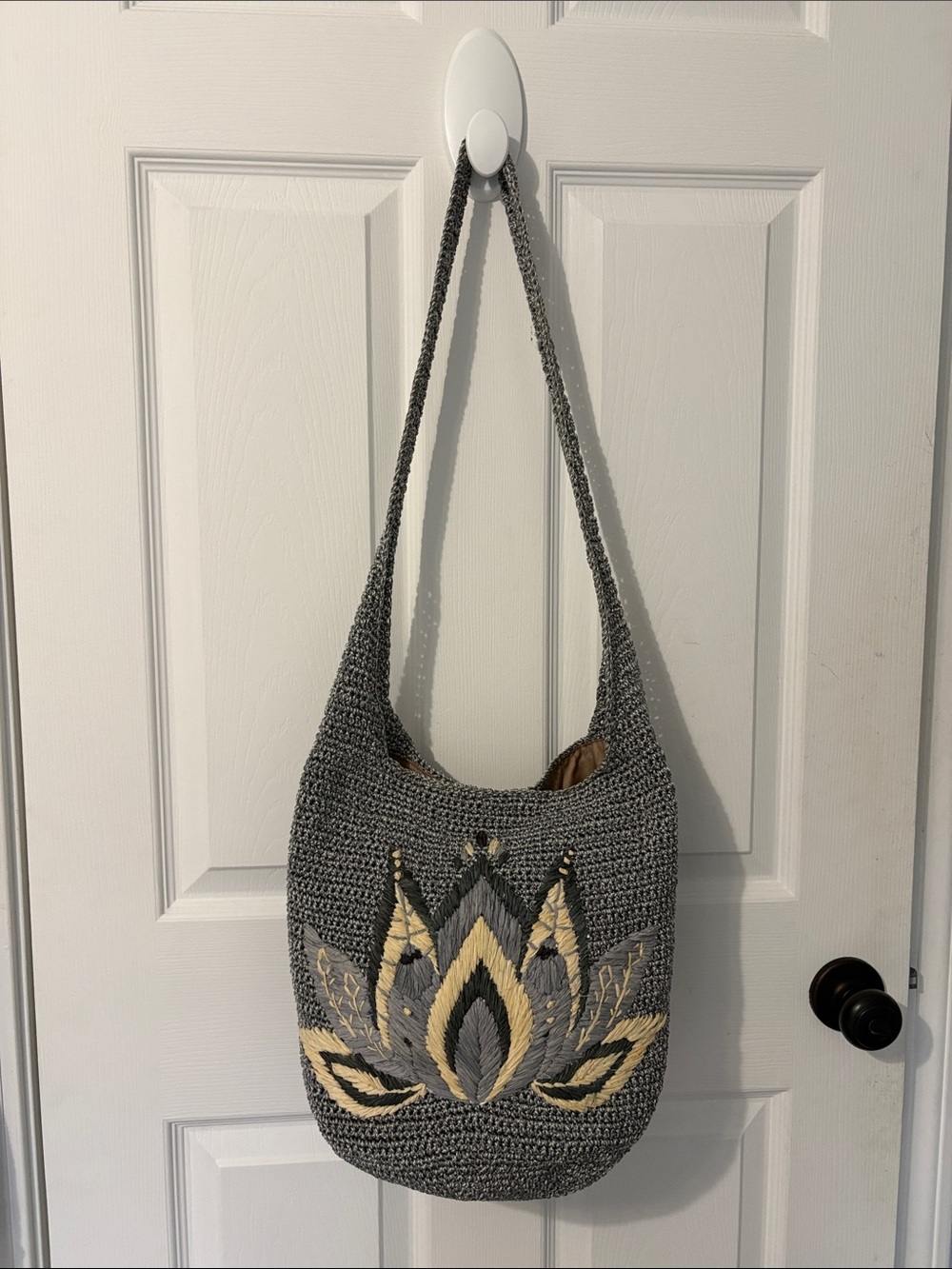 The Sak Gray Crochet Shoulder Bag with Cream Lotus Accents